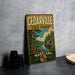 A vintage metal sign for Cedarville State Forest in Maryland, featuring a scenic illustration of a forest and a lake.