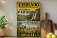A vintage-style metal sign with text and illustrations of a protected area, specifically the Cerrado National Park in Brazil.