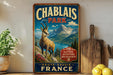 A vintage-style metal sign for Chablais Park in France, featuring a mountain landscape and a goat.