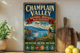 A vintage-style metal sign for "Champlain Valley National Heritage Partnership New York" is displayed on a shelf, with a potted plant and a wooden cutting board nearby.