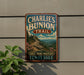 A vintage-style metal sign for the Charlie's Bunion Trail in Tennessee, featuring a scenic mountain landscape with pine trees and a winding trail.