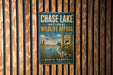 A metal sign for the Chase Lake National Wildlife Refuge in North Dakota, featuring a duck and a sign that says "A Haven for Wildlife".