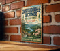 A vintage metal sign for the Chattahoochee Oconee National Forests in Georgia, featuring a scenic landscape with mountains, trees, and a river.