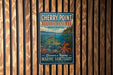 A vintage-style metal sign for Cherry Point Aquatic Reserve in Washington, featuring an illustration of marine life and the text "Discover a Thriving Marine Sanctuary".