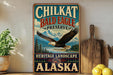 A vintage-style metal sign for Chilkat Bald Eagle Preserve in Alaska, featuring an eagle in flight and a scenic landscape.