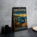 A vintage metal sign for the Chumash Heritage National Marine Sanctuary in California, featuring an illustration of a whale, a pot, and a sunset over the ocean.
