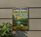 A vintage-style sign for the Cienaga Grande de Santa Marta Biosphere Reserve in Colombia, featuring a blue heron, a boat, and a scenic landscape.