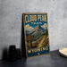 A vintage-style metal sign for the Cloud Peak Trail in Wyoming, featuring a scenic mountain landscape with a trail sign and the text "CLOUD PEAK TRAIL WYOMING WILD SCENIC".