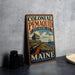 A vintage-style metal sign for the Colonial Pemaid State Historic Site in Maine, featuring an illustration of a cannon and a ship, with the text "Colonial Pemaid State Historic Site" and "MAINE" prominently displayed.