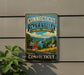 A vintage-style sign for the Connecticut River Valley, featuring a scenic landscape with a river, buildings, and a church steeple.