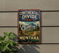 A vintage-style metal sign for the Continental Divide Trail in Montana, featuring a mountain landscape and trail marker.