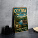 A vintage metal sign for Conway State Forest in Massachusetts, featuring a scenic landscape with pine forests, a river, and mountains.