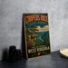 A vintage-style metal sign for the Coopers Rock State Forest in West Virginia, featuring a scenic landscape with a river and mountains.