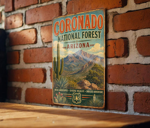 a vintage metal sign for the Coronado National Forest in Arizona, mounted on a brick wall.