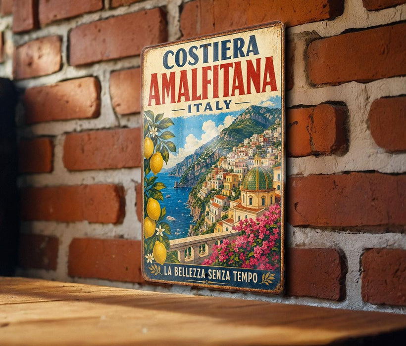 A vintage-style metal sign with a colorful illustration of a coastal town, featuring buildings, flowers, and a body of water.