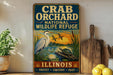 A vintage-style metal sign for the Crab Orchard National Wildlife Refuge in Illinois, featuring an illustration of a heron and a turtle in a pond.