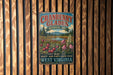 A vintage-style metal sign for the cranberry glades botanical area in West Virginia, featuring a scenic landscape with wild plants and berries.