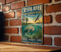 A vintage-style metal sign for the Crystal River National Wildlife Refuge in Florida, featuring an illustration of a manatee and a bird in flight.