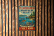 a vintage-style sign with a tropical beach scene, including a boat, palm trees, and a turtle, mounted on a wooden wall.