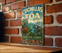 a vintage-style sign for the Cuchillas del Toa Biosphere Reserve in Cuba, hanging on a brick wall.