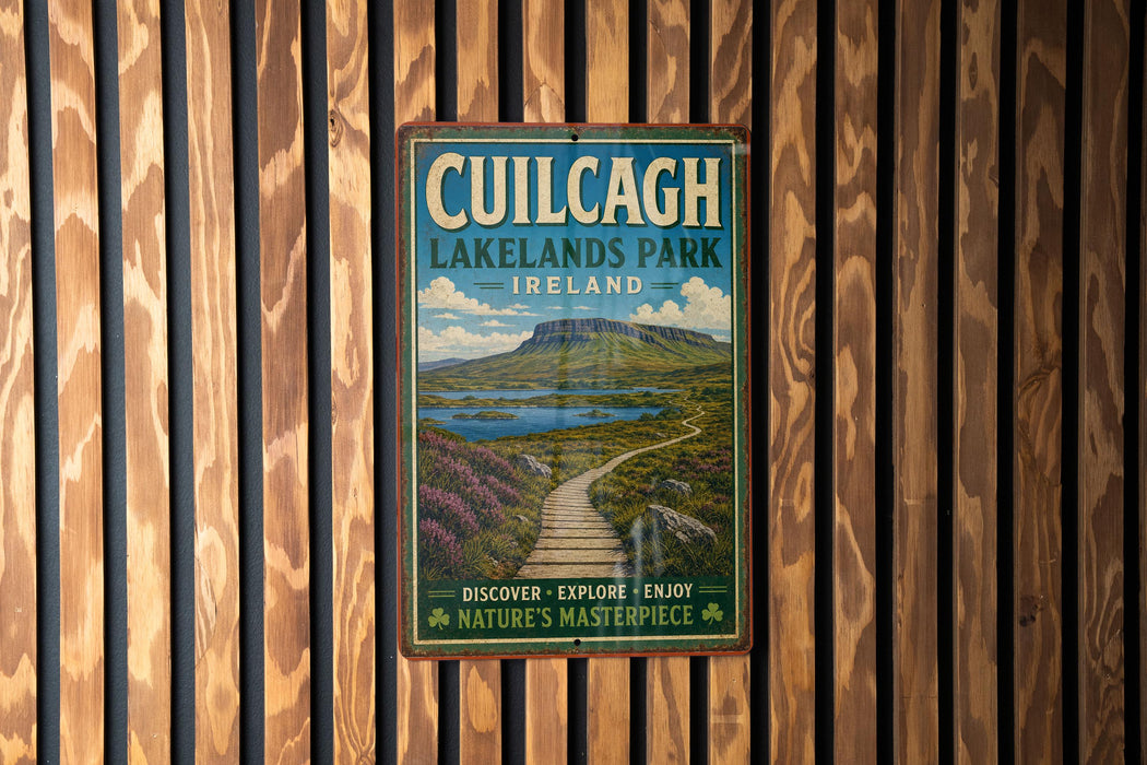 a vintage-style sign for Cuilcag Lakelands Park, Ireland, mounted on a wooden wall.
