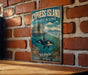 A vintage-style metal sign for the Cypress Island Aquatic Reserve in Washington, featuring an illustration of a whale swimming in the ocean.