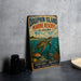 A vintage-style metal sign for Dauphin Island Marine Reserve, Alabama, featuring an illustration of a sea turtle swimming in the ocean.