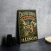 A vintage-style metal sign for David Davis mansion in Bloomington, Illinois, featuring an illustration of the mansion and the text "David Davis mansion Bloomington Illinois".