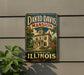 A vintage metal sign for David Davis mansion in Bloomington, Illinois, featuring an illustration of the mansion and the text "David Davis mansion Bloomington Illinois".