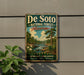 A vintage metal sign for De Soto National Forest in Mississippi, featuring a scenic landscape with a river, trees, and flowers.
