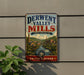 A vintage-style metal sign for the Derwent Valley Mills, a world heritage site, is displayed on a wall.