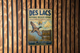 A vintage metal sign for the Des Lacs National Wildlife Refuge in North Dakota, featuring a waterfowl and a bird in flight.