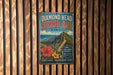 A vintage-style metal sign for the Diamond Head Summit Trail in Hawaii, featuring a scenic mountain landscape with a winding path and colorful flowers.