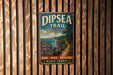 A vintage metal sign for the Dipsea Trail in California, featuring a scenic image of a trail surrounded by trees and a body of water.