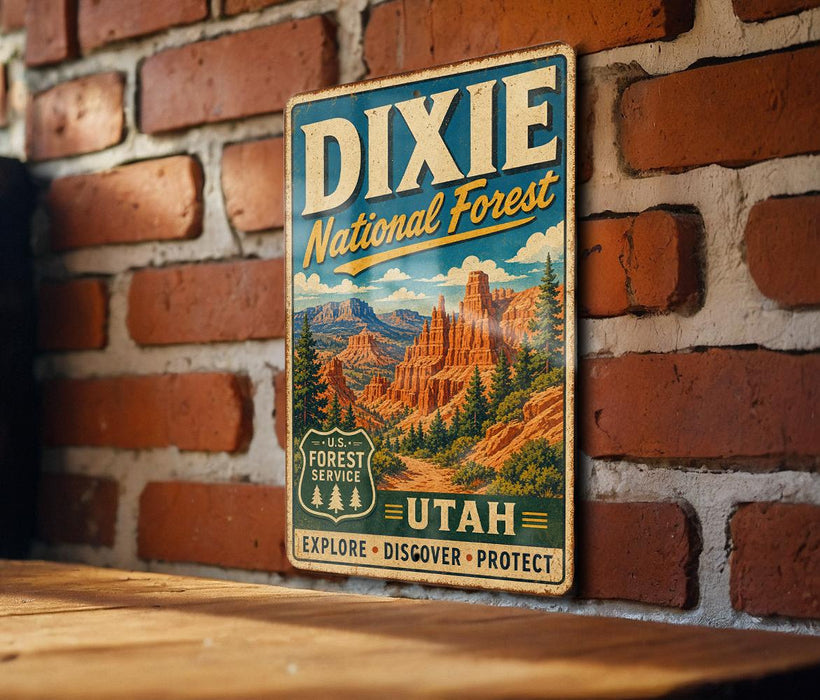A vintage metal sign for the Dixie National Forest in Utah, featuring a scenic illustration of the landscape with mountains and forests.