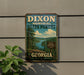 A vintage metal sign for Dixon Memorial State Forest in Georgia, featuring a scenic landscape with pine trees and a lake.