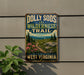 A vintage-style metal sign with the text "Dolly Sods Wilderness Trail" and "Wild & Beautiful West Virginia" is displayed on a wall, with a plant to the left.