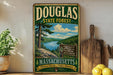 A vintage-style metal sign for Douglas State Forest in Massachusetts, featuring a scenic landscape with a river and pine trees.
