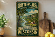 A vintage-style sign advertising the "Drifting Area Cultural Landscape" in Wisconsin, featuring a scenic landscape with a river and mountains.