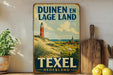 a vintage-style metal sign with a lighthouse and a pastoral landscape, placed on a shelf next to a wooden cutting board and some lemons.
