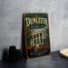 A vintage-style sign for the Dunleith Historic Inn in Mississippi, featuring an illustration of the inn's exterior and surrounded by trees and flowers.