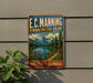 A vintage-style metal sign for E.C. Manning Provincial Park in British Columbia, Canada, featuring a scenic mountain landscape with a lake and pine trees.