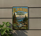 A vintage-style metal sign for the Eldorado National Forest in California, featuring a scenic landscape with mountains, pine trees, and a river.