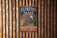 A vintage-style metal sign for Elfreth's Alley in Philadelphia, Pennsylvania, featuring an illustration of a historic district with brick buildings and a cobblestone street.