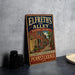 A vintage-style sign for Elfreth's Alley Historic District in Philadelphia, Pennsylvania, featuring an illustration of a street scene with brick buildings and a tree.
