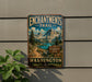 A vintage-style metal sign for the Enchanted Trail in Washington, featuring a scenic mountain landscape with a lake and pine trees.