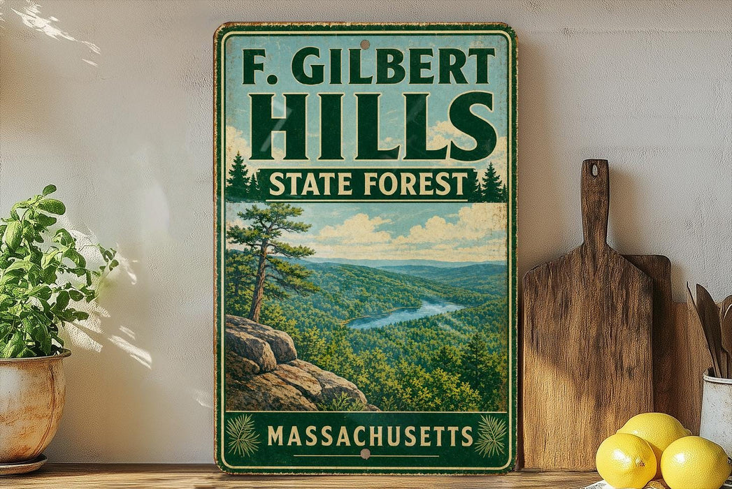 a vintage-style sign for F. Gilbert Hills State Forest in Massachusetts, with a scenic landscape of mountains, trees, and a river.