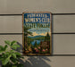 A metal sign on a wall, featuring a scenic image of a forest and a lake, with the text "Federated Women's Club State Forest, Massachusetts" and "NATURE BEAUTY RECREATION" below it.