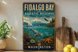 a vintage-style sign for Fidalgo Bay Aquatic Reserve in Washington, with a scenic illustration of a seascape, a sailboat, and marine life.