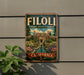 A vintage-style metal sign for the Filoli Historic House & Garden in California, featuring a detailed illustration of the historic house surrounded by lush gardens and a pond.